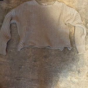 a cropped ish light sweater